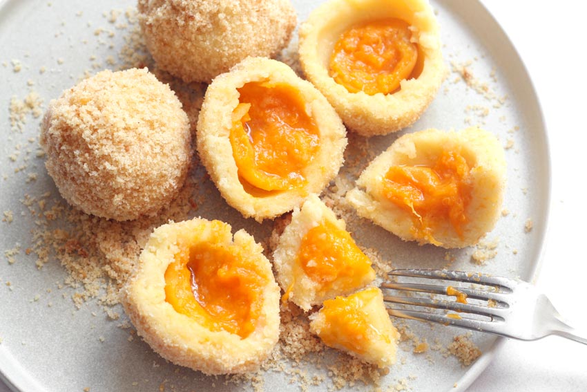 Apricot dumplings on plate