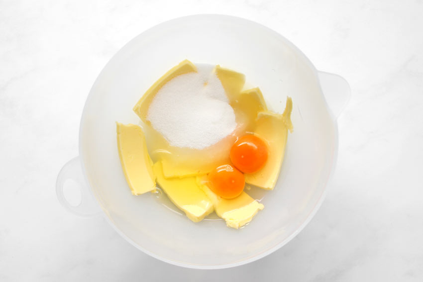 butter, sugar, and eggs in bowl