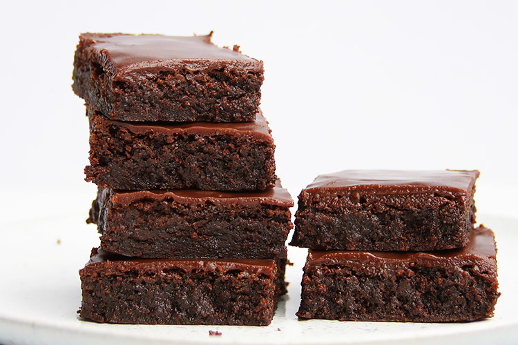 cut poppy seed brownies on plate