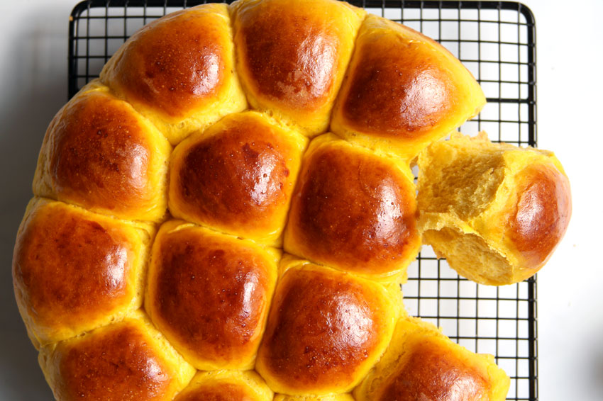 pumpkin dinner rolls on rack