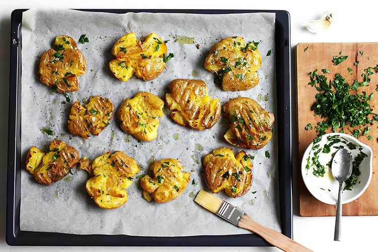 Garlic and herbs for crispy smashed potatoes