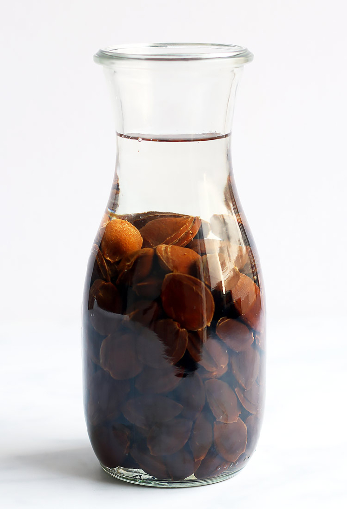 Homemade Amaretto Liqueur recipe with apricot pits