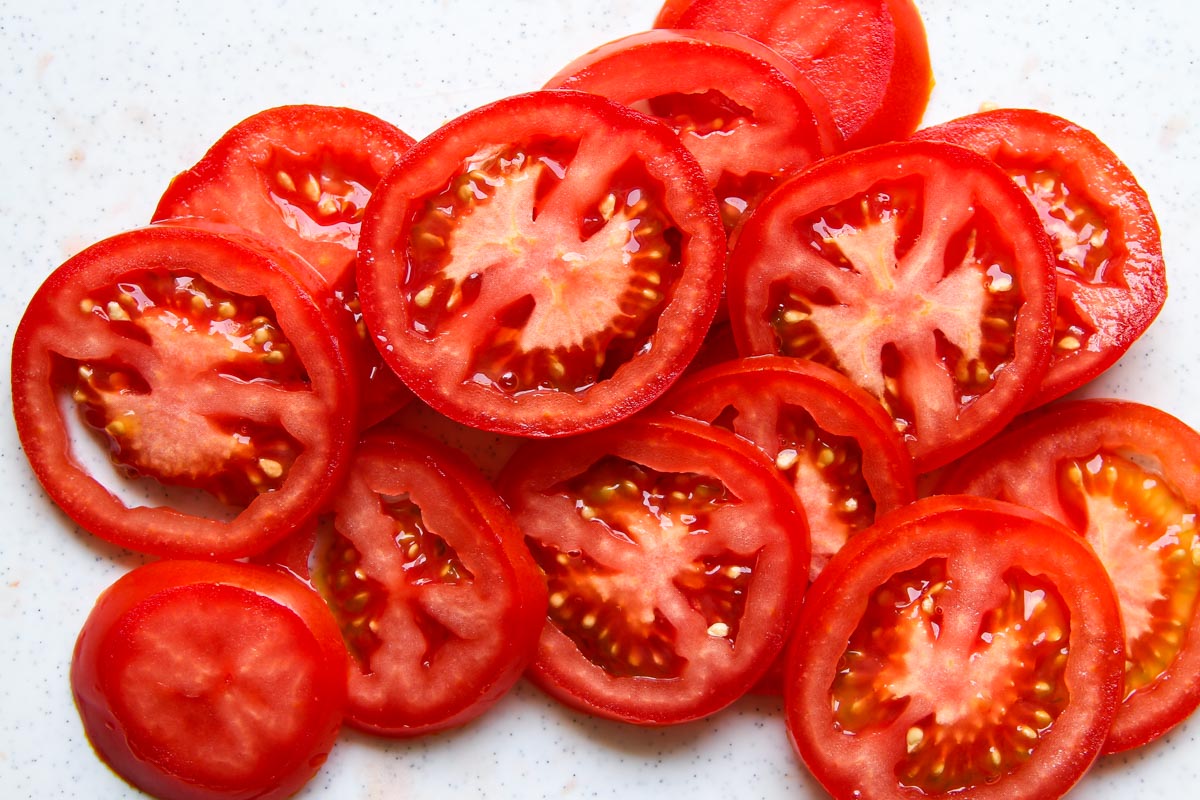 Sliced tomatoes for Caprese Salad